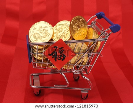 Gold coins in shopping cart,Chinese New Year Calligraphy for \