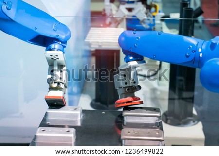 robot arm polishing the automotive part in the production line.