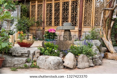 Chinese traditional style stone mill in Chinese old ancient building garden