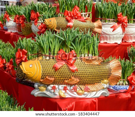 narcissus blooming in shape of golden fish,traditional chinese calligraphy art means good luck