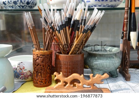 Chinese writing brushes and inkstone on the table,the word mean make of brush