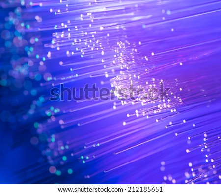 optical fibers flying from deep on technology background