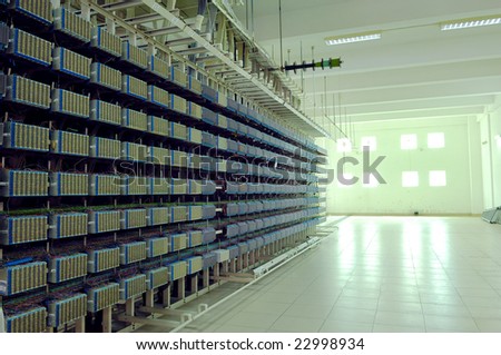 a shot of network cables and servers in a technology data center