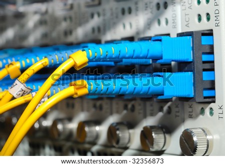 network hub and patch cables,Fiber cables connected to servers in a datacenter