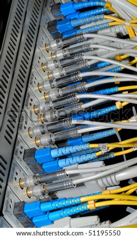 network hub and patch cables,Fiber cables connected to servers in a datacenter
