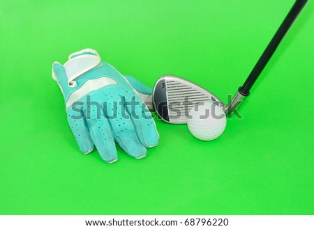 metal golf driver and glove