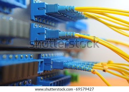 shot of network cables and hub in a technology data center