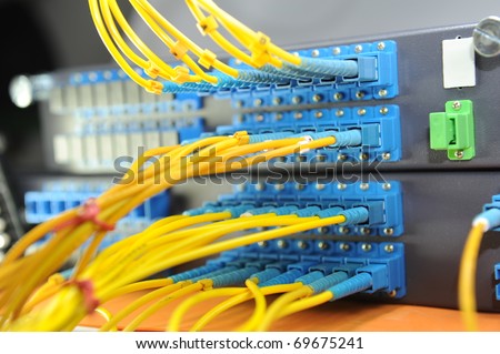 shot of network cables and servers in a technology data center