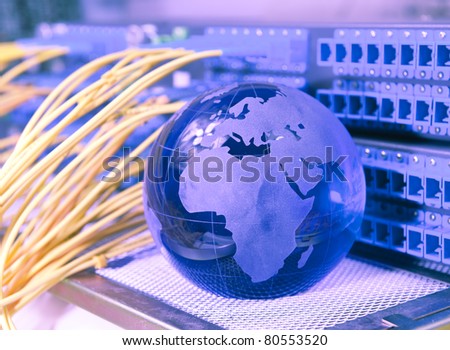 globe with network cables and servers in a technology data center
