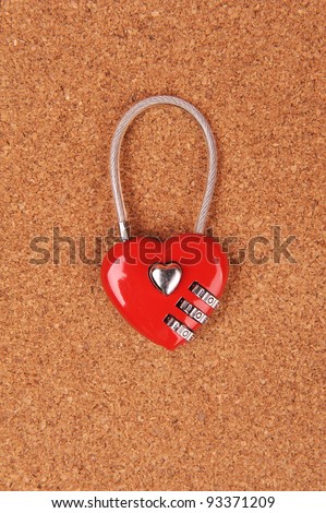 heart shape lock locked up with wood background