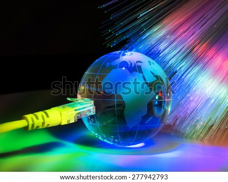 glass earth with network against fiber optic background