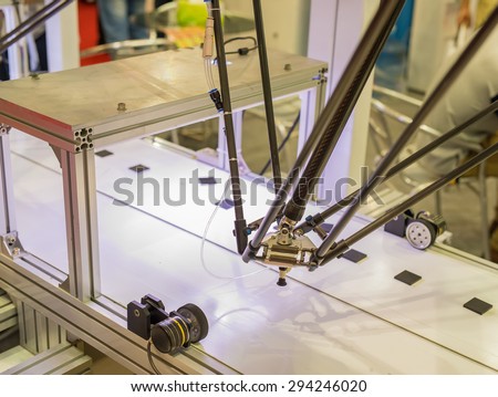 Industrial robot working in factory,Conveyor Tracking Controler of robotic hand.