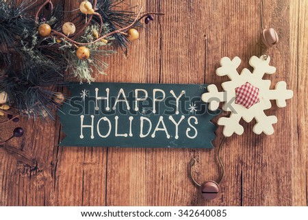 happy Holiday written on wooden background