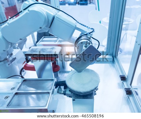 Industrial robot working in phone factory