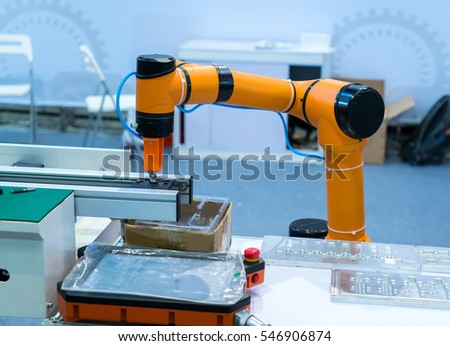 robot arm working in phone factory