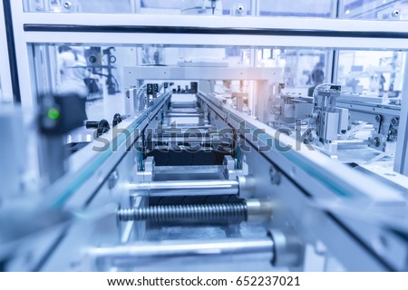 Industrial robot with vacuum suckers with conveyor in manufacture factory,Smart factory industry 4.0 concept.
