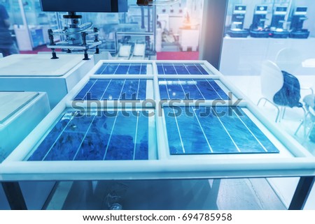 production of solar panels, Industrial robot working in factory,Conveyor Tracking Controler of robotic hand.