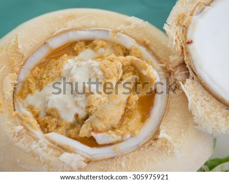 Steamed curry fish, shrimps ,crab and squid in coconut
