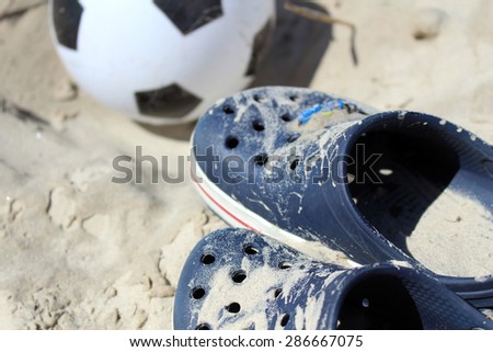 shoes with soccer ball on sand beach. Wears Summer Shoes. shoes as Prince