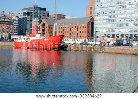LIVERPOOL, UK - OCTOBER 1, 2015: Albert Dock at Liverpool showing red Bar ship and architecture