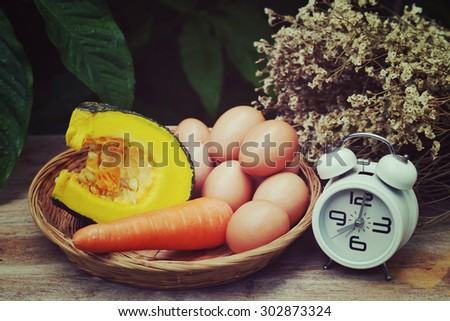 Prepare breakfast, Eggs and vegetables on wooden basket in vintage style