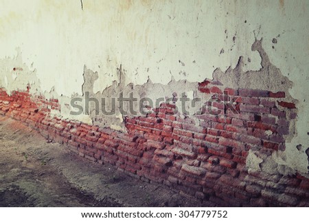 Old plaster walls in vintage style. Texture of damaged brick wall