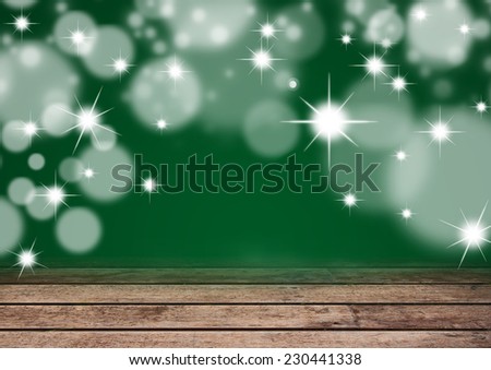 Christmas bokeh background with empty wooden table. Perfect for product display montage