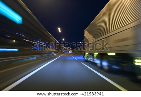 Truck driving on highway at night