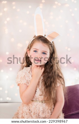 Portrait of a little girl on Christmas or Eastern with bunny ears.