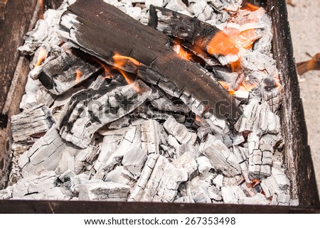 ashes in an iron box, barbecue, fire