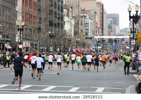 BOSTON, MA - APRIL 20: Runners cross the finish line at the Boston Marathon at the Boston Marathon in action April 20, 2009 in Boston. About 25,000 runners took part in the 113th edition.