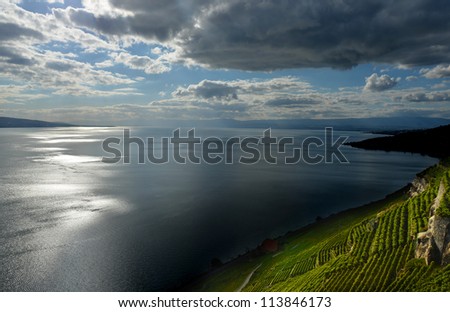Light and Dark play on Lake Geneva and the UNESCO listed vinyards of Lavaux, near Montreux in Switzerland