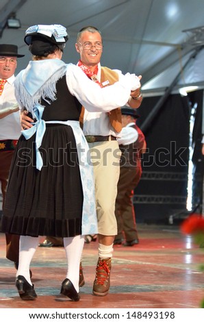 NENDAZ, SWITZERLAND - JULY 27: Traditional dancing at the International Alpine Horn Festival:  July  27, 2013 in Nendaz, Switzerland