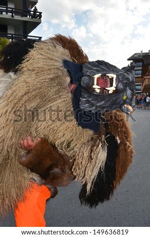 NENDAZ, SWITZERLAND - JULY 27: Parade of evil spirits in Switzerland at the International Alpine Horn Festival:  July  27, 2013 in Nendaz, Switzerland