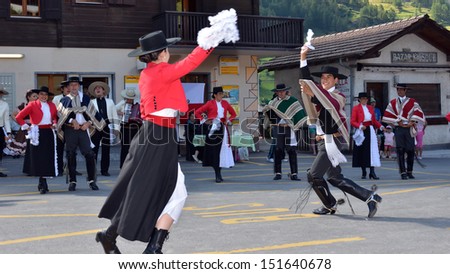 EVOLENE, SWITZERLAND - AUGUST 13: Chilean dance partners and orchestra at the International Festival of Folklore and Dance from the mountains (CIME) :  August 13, 2013 in Evolene Switzerland