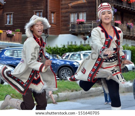 EVOLENE, SWITZERLAND - AUGUST 13: Yakutsk dancers at the International Festival of Folklore and Dance from the mountains (CIME) :  August 13, 2013 in Evolene Switzerland
