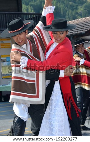 EVOLENE, SWITZERLAND - AUGUST 13: Chilean dance partners at the International Festival of Folklore and Dance from the mountains (CIME) :  August 13, 2013 in Evolene Switzerland