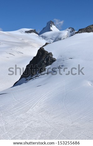 The Dent d\'Herens in the southern swiss alps on the border with Italy, surrounded by high glaciers. At the head of the Val d\'Herens, it lies close to the famous Haute Route from Chamonix to Zermatt
