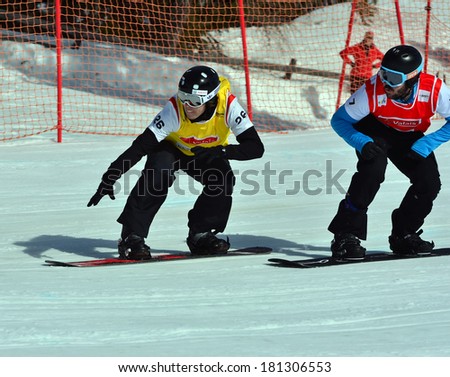 VEYSONNAZ, SWITZERLAND - MARCH 11: LINDFORS (FIN) leads HERNANDES (SPA) in the Snowboard Cross World Cup: March 11, 2014 in Veysonnaz, Switzerland