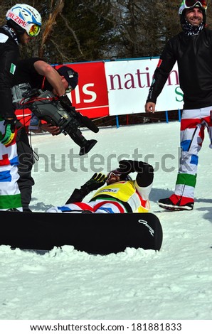 VEYSONNAZ, SWITZERLAND - MARCH 11: TV descends on the world champion Fabio CORDI (ITA) in the Snowboard Cross World Cup final: March 11, 2014 in Veysonnaz, Switzerland