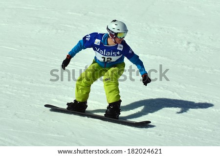 VEYSONNAZ, SWITZERLAND - MARCH 11: Zoe GILLINGS (GBR) preparing to jump in the Snowboard Cross World Cup: March 11, 2014 in Veysonnaz, Switzerland