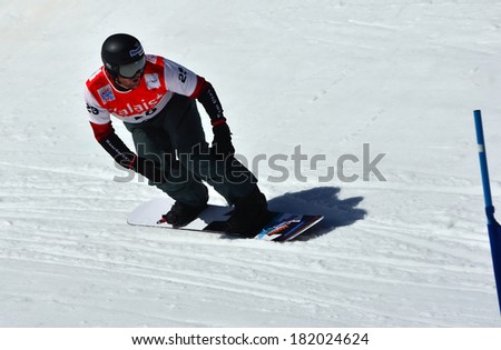 VEYSONNAZ, SWITZERLAND - MARCH 11: Mick DIERDORFF (USA) preparing to jump in the Snowboard Cross World Cup: March 11, 2014 in Veysonnaz, Switzerland