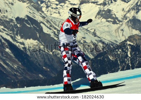 VEYSONNAZ, SWITZERLAND - MARCH 11: Nikolay OLYUNIN (RUS) preparing to jump in the Snowboard Cross World Cup: March 11, 2014 in Veysonnaz, Switzerland