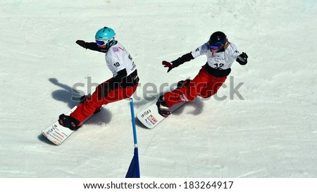 VEYSONNAZ, SWITZERLAND - MARCH 11: GODINO (ITA) leads VUAGNOUX (FRA) in the Snowboard Cross World Cup: March 11, 2014 in Veysonnaz, Switzerland