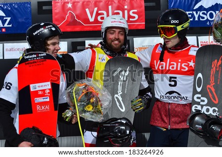 VEYSONNAZ, SWITZERLAND - MARCH 11: Podium l to r LINFORS, CORDI, and ROBANSKE in the Snowboard Cross World Cup: March 11, 2014 in Veysonnaz, Switzerland