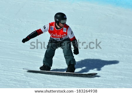 VEYSONNAZ, SWITZERLAND - MARCH 11: Mick DIERDORFF (USA) competing in the Snowboard Cross World Cup: March 11, 2014 in Veysonnaz, Switzerland