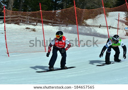 VEYSONNAZ, SWITZERLAND - MARCH 11: ROBANSKE (CAN) leads SCHAD (GER) in the Snowboard Cross World Cup: March 11, 2014 in Veysonnaz, Switzerland