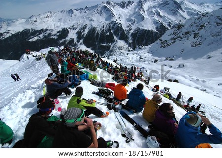 NENDAZ, SWITZERLAND - MARCH 15: Spectators in the snow watching the Nendaz Freeride Finals: March 15, 2014 in Nendaz, Switzerland