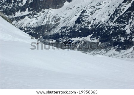 a serious off trail skiing accident on the Mt Blanc, and a helicopter arriving to carry the victim away