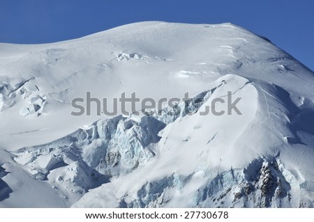 glaciers and blocks of ice (seracs)  under a fresh coating of snow on the dome du gouter in the french alps
